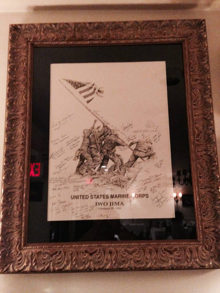 Flag Raising lithograph signed by Iwo survivors at Manducatis Restaurant in Long Island City. Site of our annual Iwo Jima Dinner. Photo courtesy of Joe Lisi.