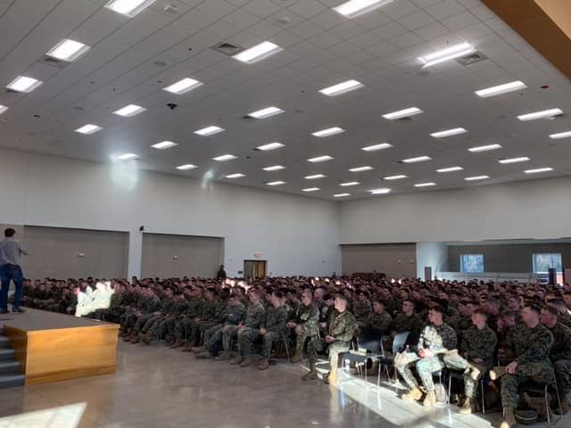 McNamara (on stage) teaching his Post-Traumatic Winning to Marines of 2nd Marine Division in 2018.