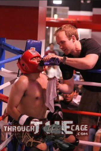 Sloan coaching a kickboxing fight. Photo courtesy of Justin Sloan.