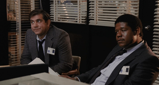 Lauria with Forest Whitaker (right) in the movie <em>Stakeout</em>. Photo courtesy of IMDB.com.