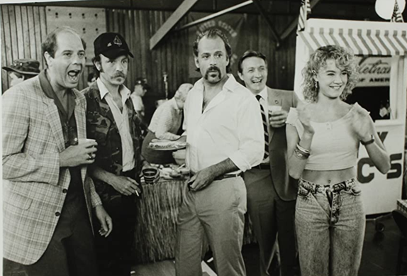 From left to right are Stephen Toblowsky, Beaver, Bruce Willis, Ken Jenkins and Emily Llyod in the film <em>In Country</em>. Photo courtesy of IMDB.com.
