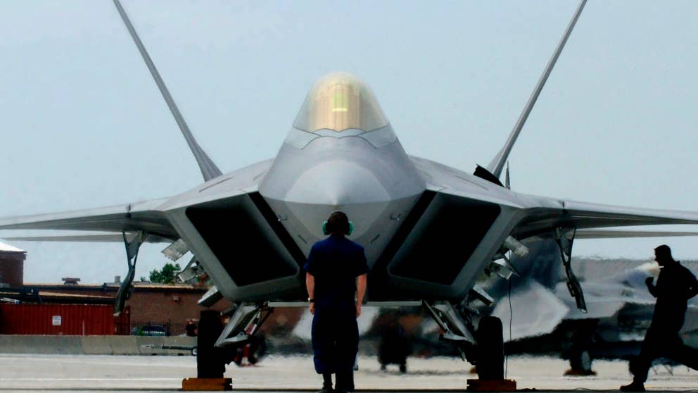 F-22A Raptor Demonstration Team aircraft maintainers prepare to launch out Maj. Paul "Max" Moga, the first F-22A Raptor demonstration team pilot, July 13. (U.S. Air Force photo/Senior Airman Christopher L. Ingersoll)