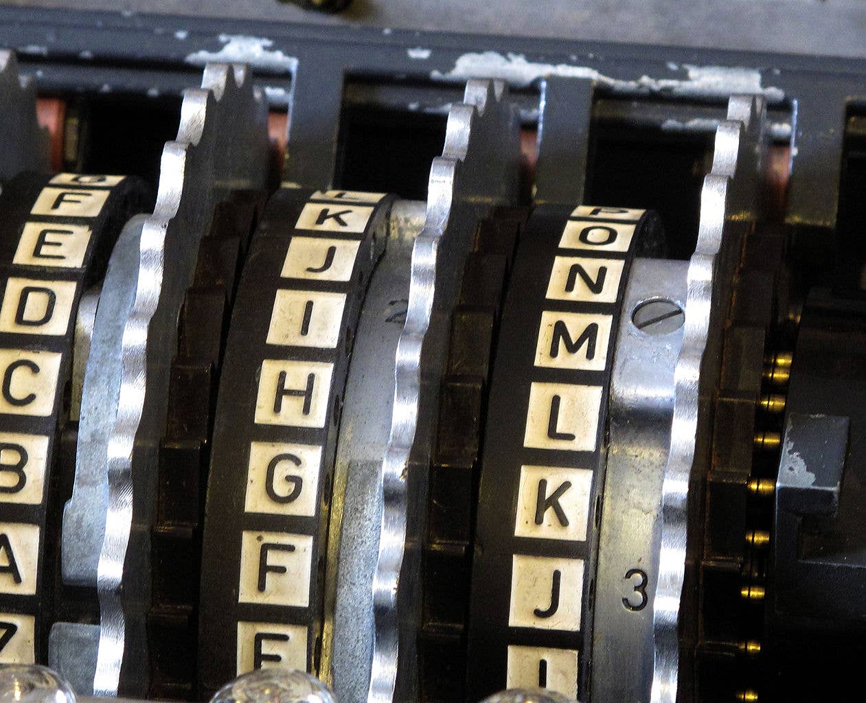  Enigma wheels within alphabet rings in position in an Enigma scrambler. (Wikipedia)