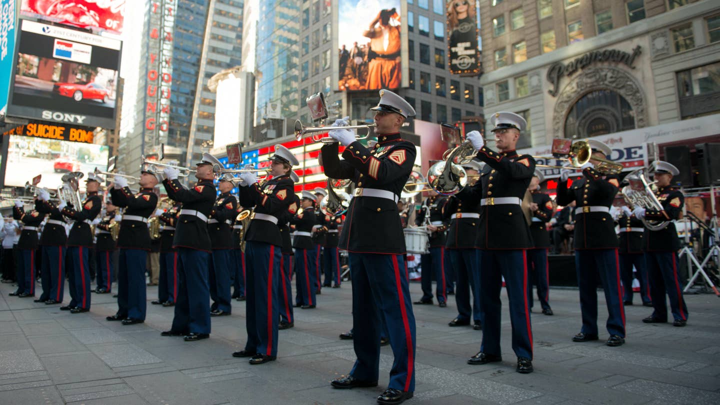 The Quantico Marine Corps Band Performed at Times Square with more than 1,000 high school student for the Band of Prde Tribute Concert on November 10, 2014. The bands drew crowds of people who stood by, rendered salutes, took photos and video recorded lasting memories.