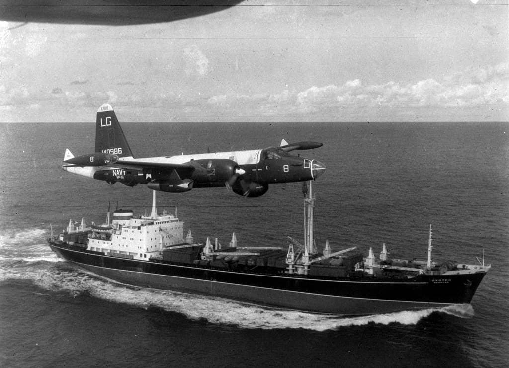 A U.S. Navy Lockheed SP-2H Neptune (BuNo 140986) of patrol squadron VP-18 Flying Phantoms flying over a Soviet freighter. (U.S. Navy photo)