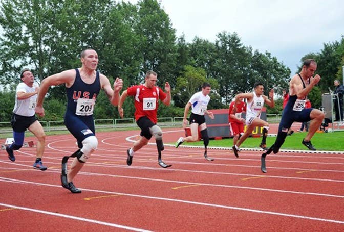Sgt. Ryan McIntosh, second from left, battles U.S. Army World Class Athlete Program track and field teammate Sgt. Rob Brown (far right) in the 100-meter dash in 2014 (U.S. Army)
