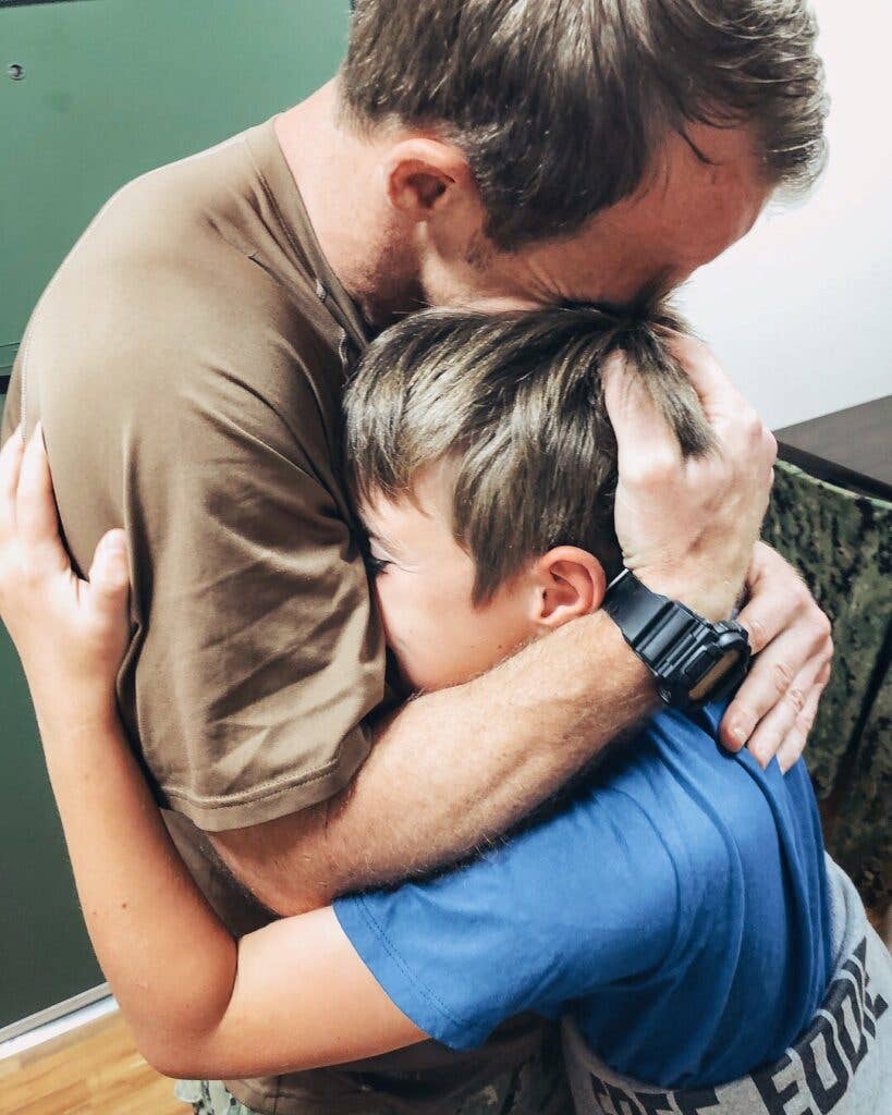 Eddie reuniting with one of his children after his arrest. Photo provided by Eddie and Andrea Gallagher.