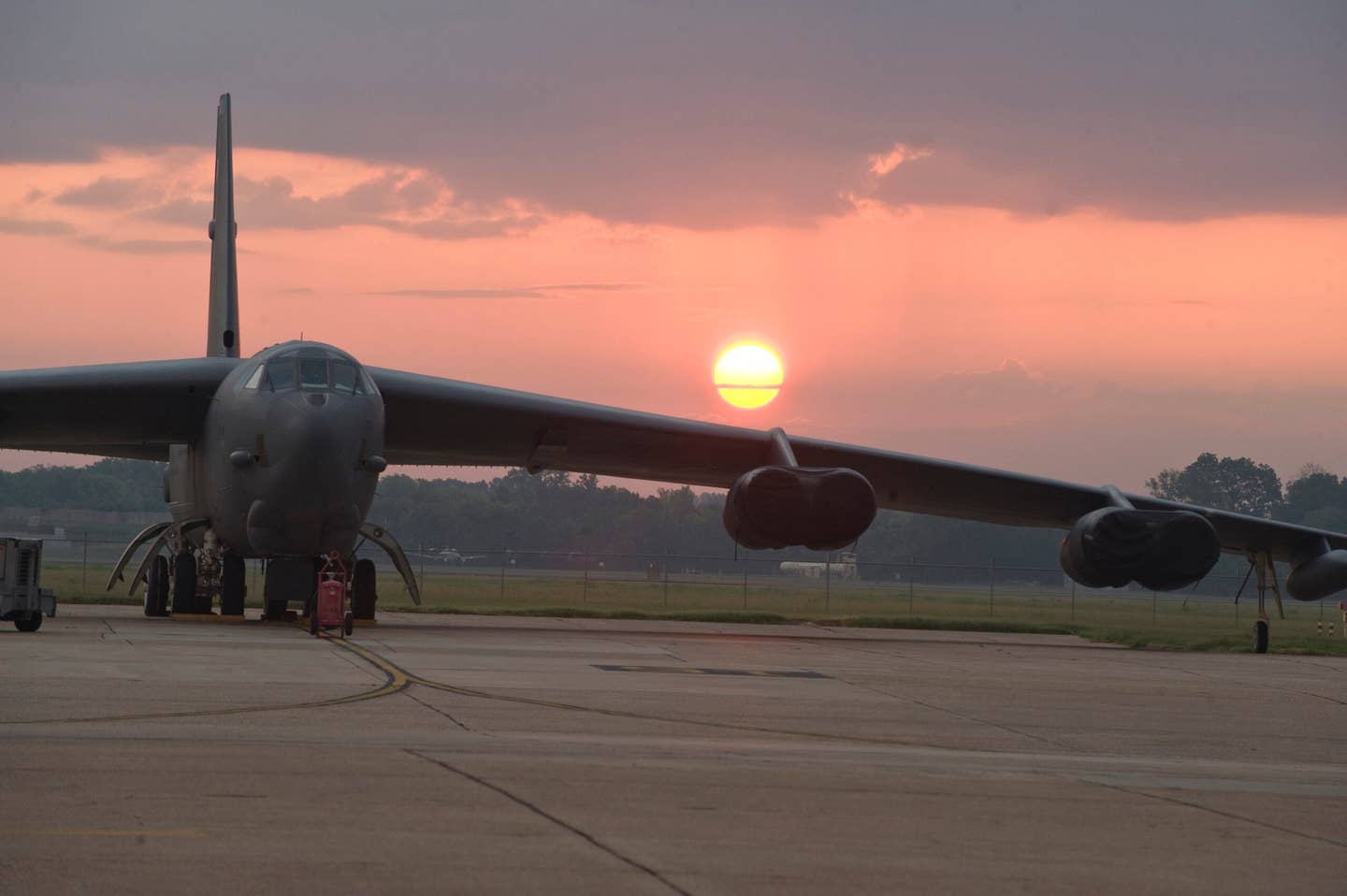 The sun rises behind a B-52H Stratofortress on the flight line of Barksdale Air Force Base, La., July 27. The B-52 is capable of flying 7,652 nautical miles or 8,800 miles without being refueled by another aircraft. The BUFF is classified as a long-range, heavy bomber and is capable of carrying 70,000 pounds of mixed ordnance. (U.S. Air Force photo/Airman 1st Class Micaiah Anthony)(RELEASED)