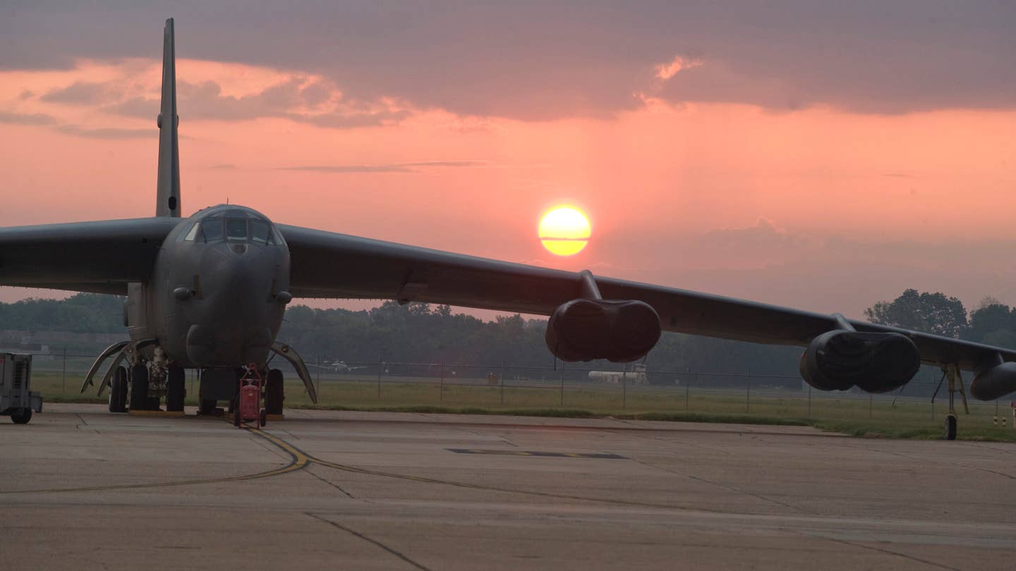 The sun rises behind a B-52H Stratofortress on the flight line of Barksdale Air Force Base, La., July 27. The B-52 is capable of flying 7,652 nautical miles or 8,800 miles without being refueled by another aircraft. The BUFF is classified as a long-range, heavy bomber and is capable of carrying 70,000 pounds of mixed ordnance. (U.S. Air Force photo/Airman 1st Class Micaiah Anthony)(RELEASED)