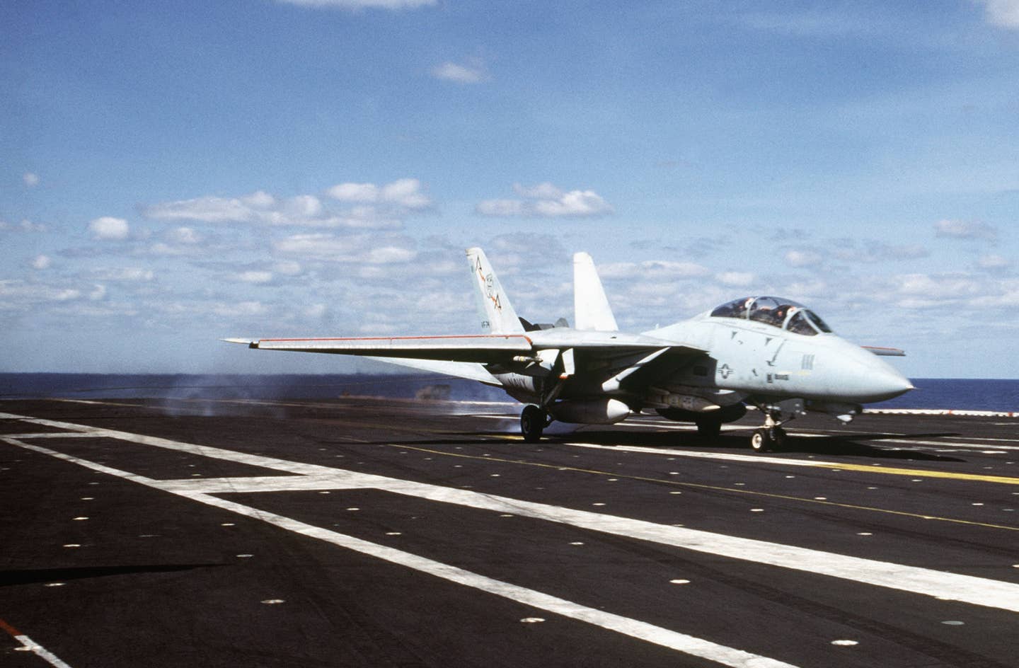 An F-14 lands aboard the USS Saratoga in 1985 (U.S. Navy)