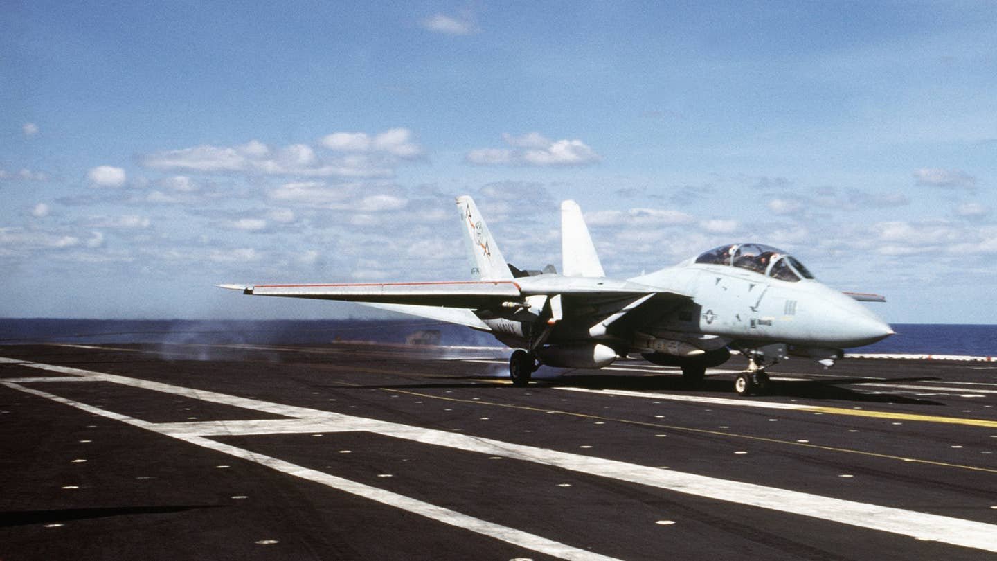An F-14 lands aboard the USS Saratoga in 1985 (U.S. Navy)