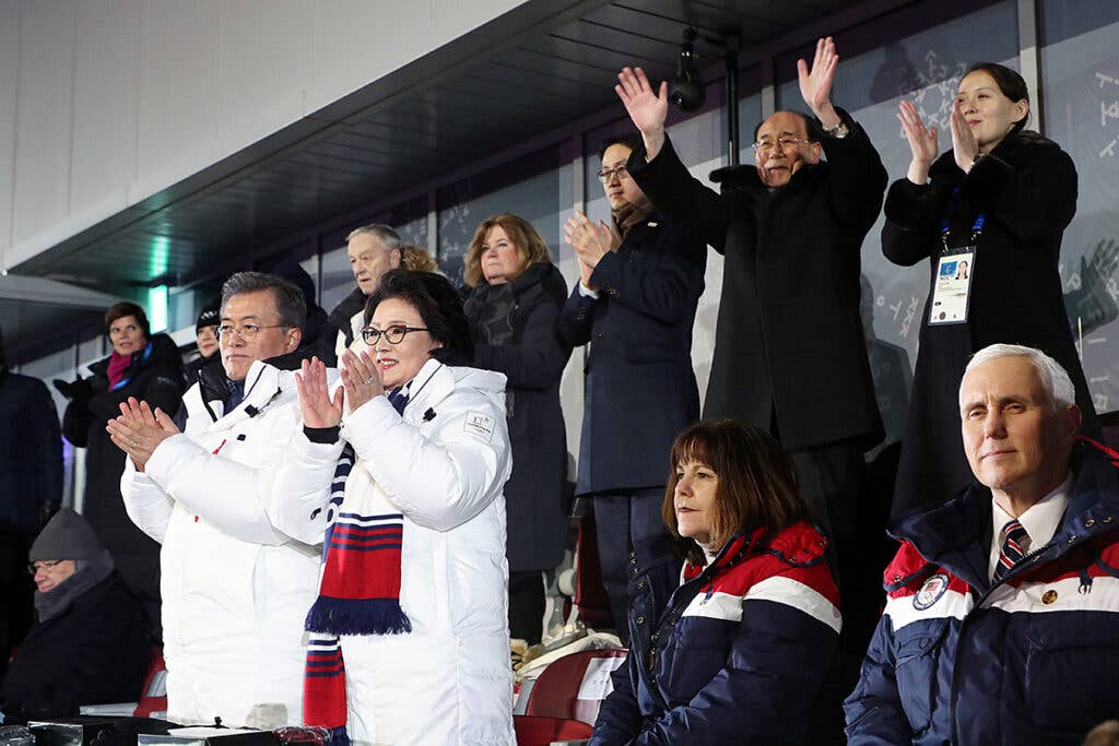 Kim Yo Jong attending the opening ceremonies of the 2018 Olympics, seated just being then-Vice President Pence and South Korean President Moon Jae-in (Wikimedia Commons)