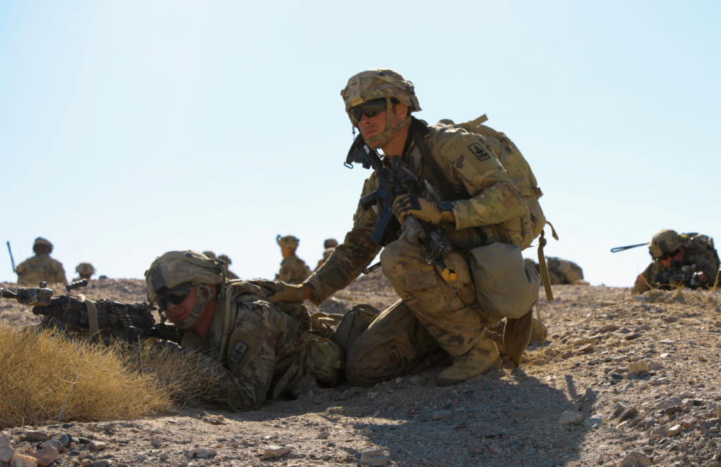 Soldiers with the 1st Battalion, 297th Infantry Regiment, Wyoming Army National Guard, prepares to assault an objective during a combat exercise at the National Training Center, Fort Irwin, California, June 12, 2021. The 1-297th is supporting the 155th Armored Brigade Combat Team’s, Mississippi Army National Guard, training rotation at NTC. (Mississippi National Guard photo by Sgt. Taylor Cleveland)