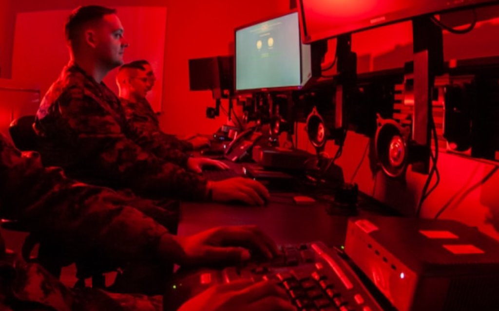 Marines with Marine Corps Forces Cyberspace Command  in cyber operations room at Lasswell Hall aboard Fort Meade, Maryland. MARFORCYBER Marines conduct offensive and defensive cyber operations in support of United States Cyber Command and operate, secure and defend the Marine Corps Enterprise Network. USMC Photo.