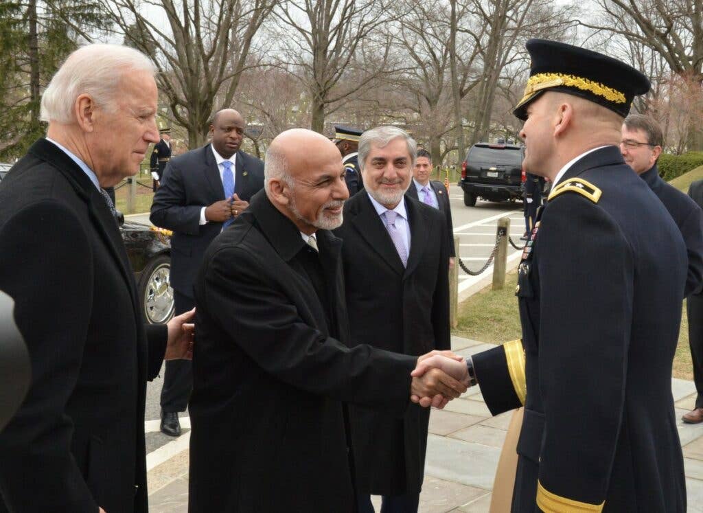 Afghanistan's President, Ashraf Ghani, is welcomed to Arlington National Cemetery by Maj. Gen. Jeffrey S. Buchanan, alongside then-Vice President Biden in 2015 <em>(Photo Credit: U.S. Army)</em>