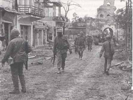 Marines patrolling the streets in Hue after Tet Offensive (U.S. Army)
