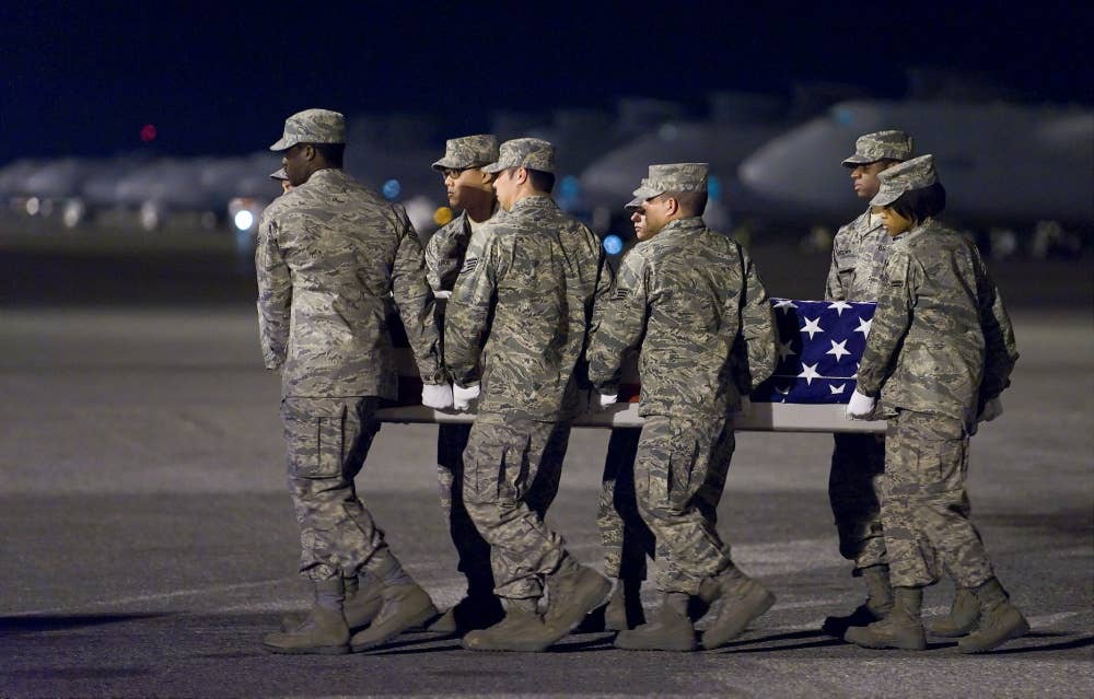 U.S. Air Force airmen transfer the remains of Air Force Staff Sgt. Phillip A. Myers during an arrival ceremony at Dover Air Force Base, Del., on April 5, 2009. Myers died April 4, 2009, near the Helmand province of Afghanistan. DoD photo by Roland Balik, U.S. Air Force. (Released)