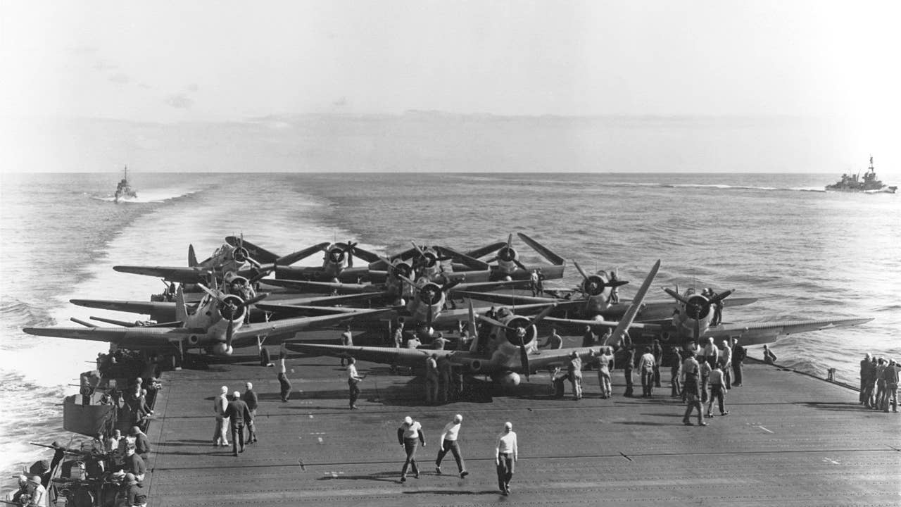 U.S. Navy Torpedo Squadron 6 (VT-6) Douglas TBD-1 Devastator aircraft are prepared for launching aboard the aircraft carrier USS Enterprise (CV-6) at about 0730-0740 hrs, 4 June 1942. (Wikimedia Commons)