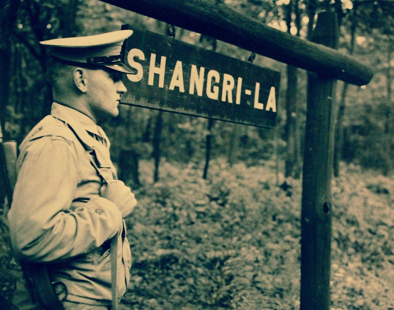 U.S. Marine standing guard at Shangri-La, Maryland, circa WWII. Office of War Information Collection.
