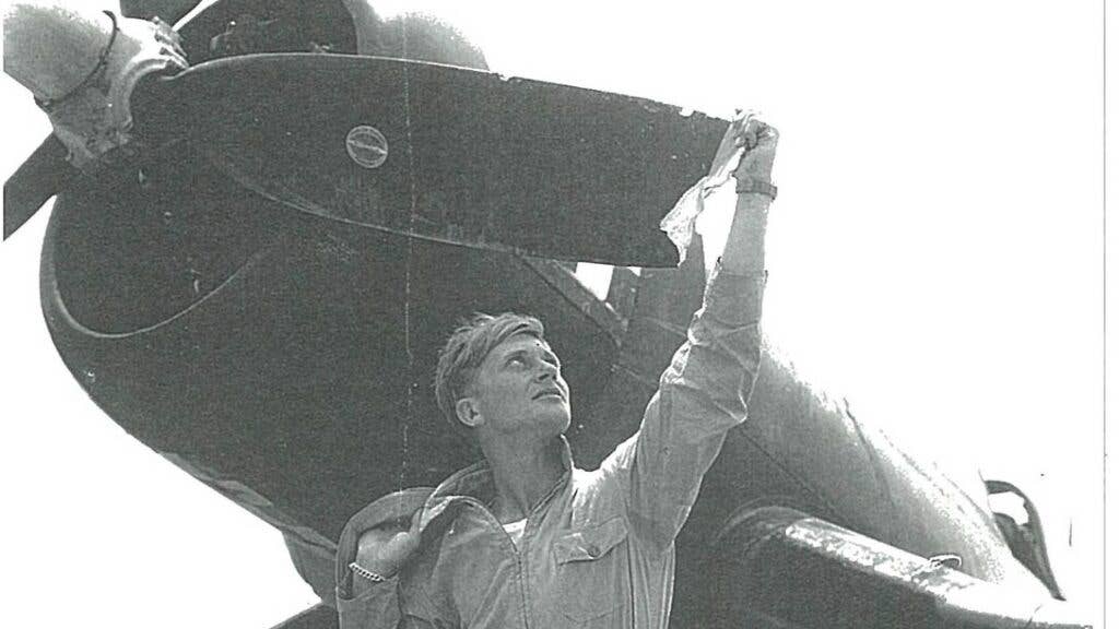 Klingman, presumably cleaning the Japanese plane off his new weapon of choice (U.S. Marine Corps photo by Roger Klingman)