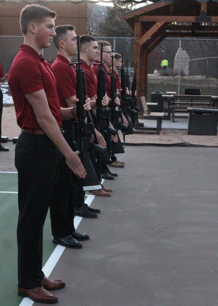 <em>The <em>Oklahoma University</em></em> <em>NROTC Midshipman Drill Team (Oklahoma University NROTC)</em>