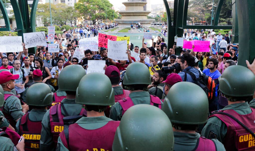 Protests in Altamira Square in the capital of Caracas are met by Venezuelan National Guard, 2014 (Wikimedia Commons)<br><br>