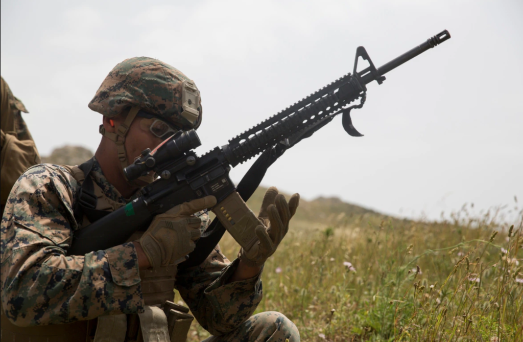 <meta charset="utf-8">
<em>A Marine loads his M16A4 with a PMAG (U.S. Marine Corps)</em>