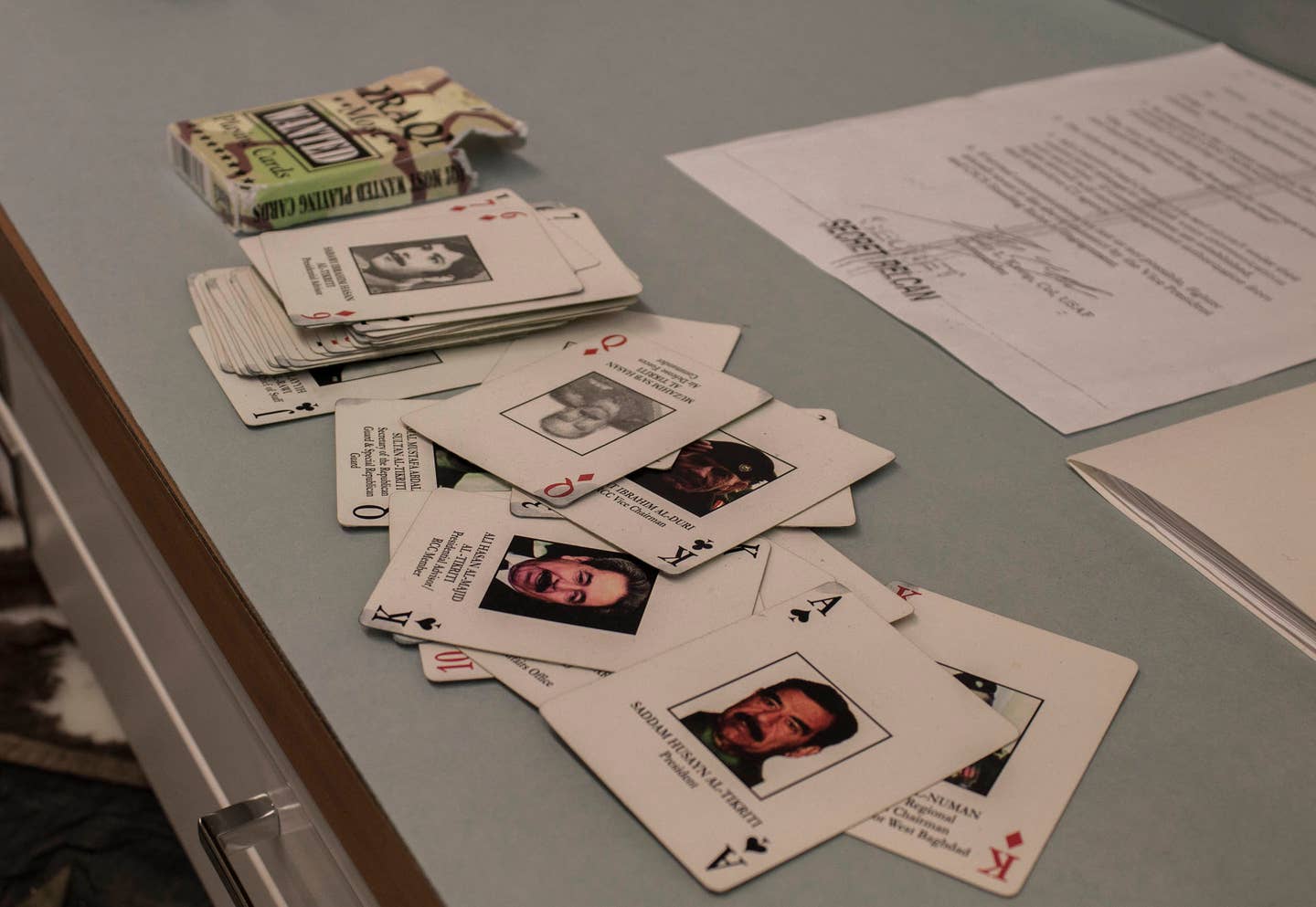 Graduate students from University of New Orleans public history department tour the Louisiana National Guard Museum April 11. A stack of playing cards displaying Iraq War's "most wanted" rests on a shelf in the museum's archive department.  (U.S. Army photo by Sgt. Karen Sampson/Released)