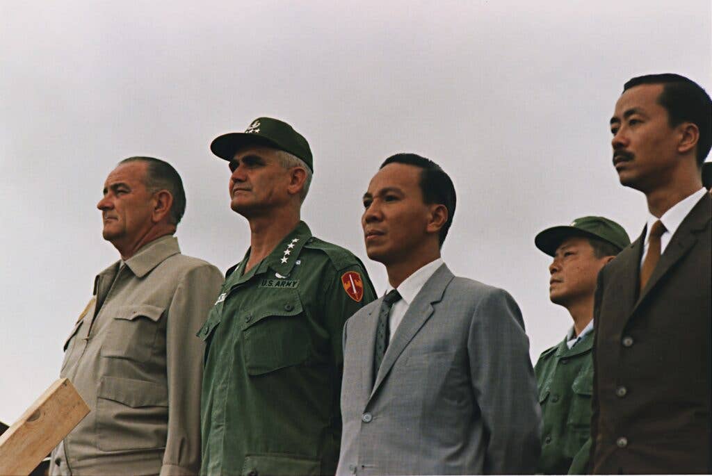 Nguyễn Cao Kỳ (right) next to Thieu, General William Westmoreland and President Johnson, 1966 (National Archives and Records)<br>