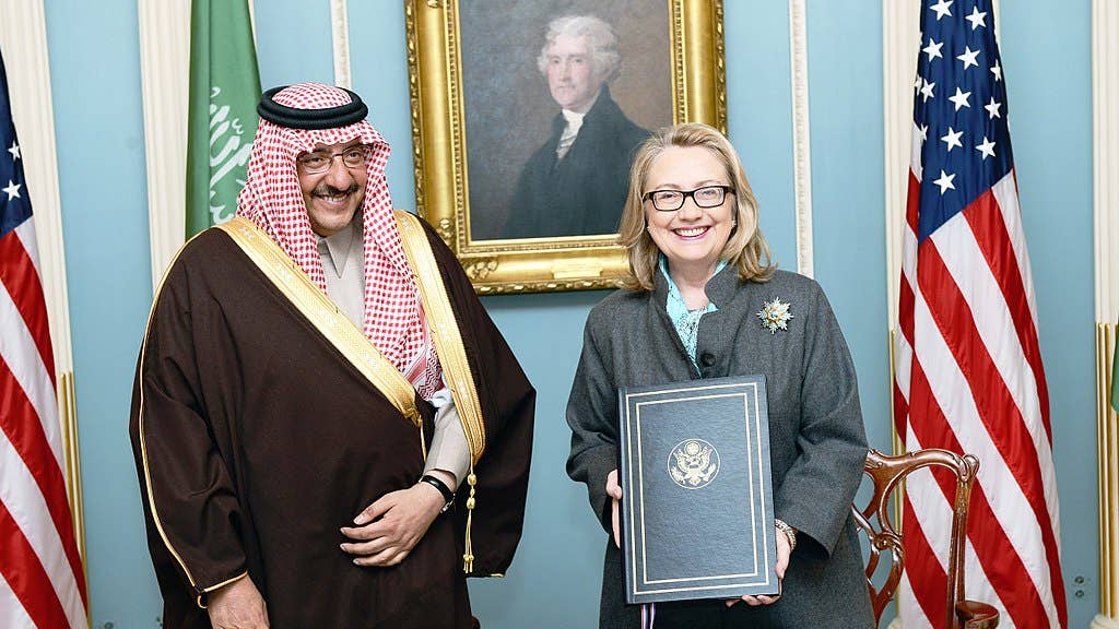 U.S. Secretary of State Hillary Rodham Clinton poses for a photo with Interior Minister of Saudi Arabia, Prince Mohammed bin Naif bin Abdulaziz, after a singing ceremony at the U.S. Department of State in Washington, D.C., January 16, 2013. [State Department photo/ Public Domain]