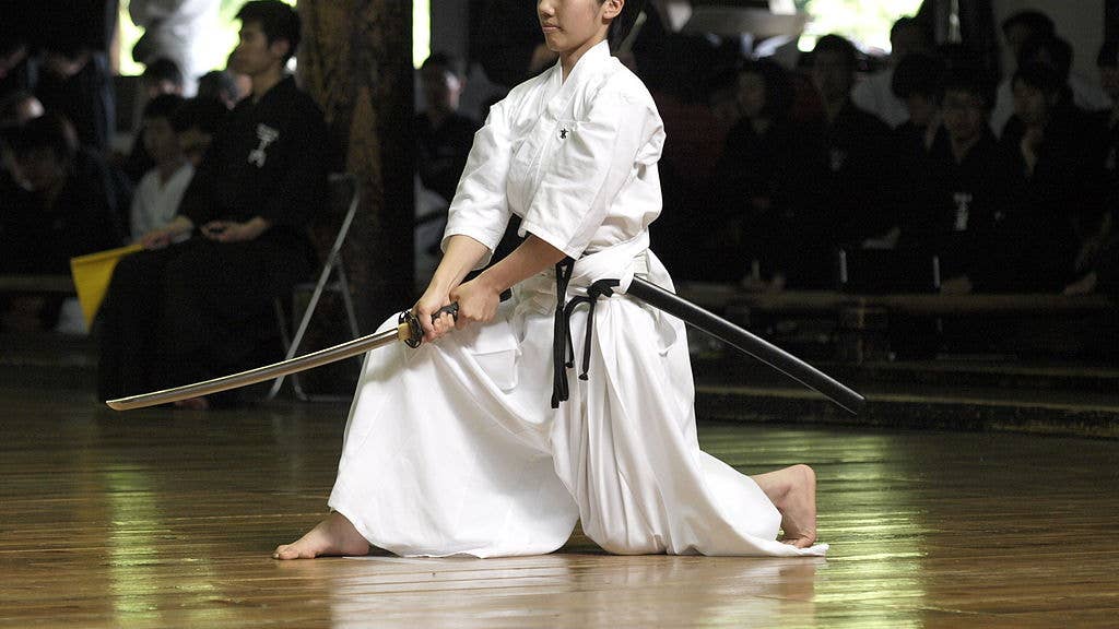 Japanese girl practicing Iaido with a custom made katana. (Wikipedia)