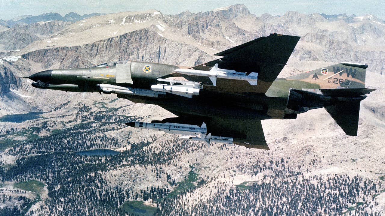 An F-4G Phantom II aircraft shows its undercarriage holding four different missiles: one each AGM-45, AGM-65, AGM-78, and AGM-88. (Wikimedia Commons)