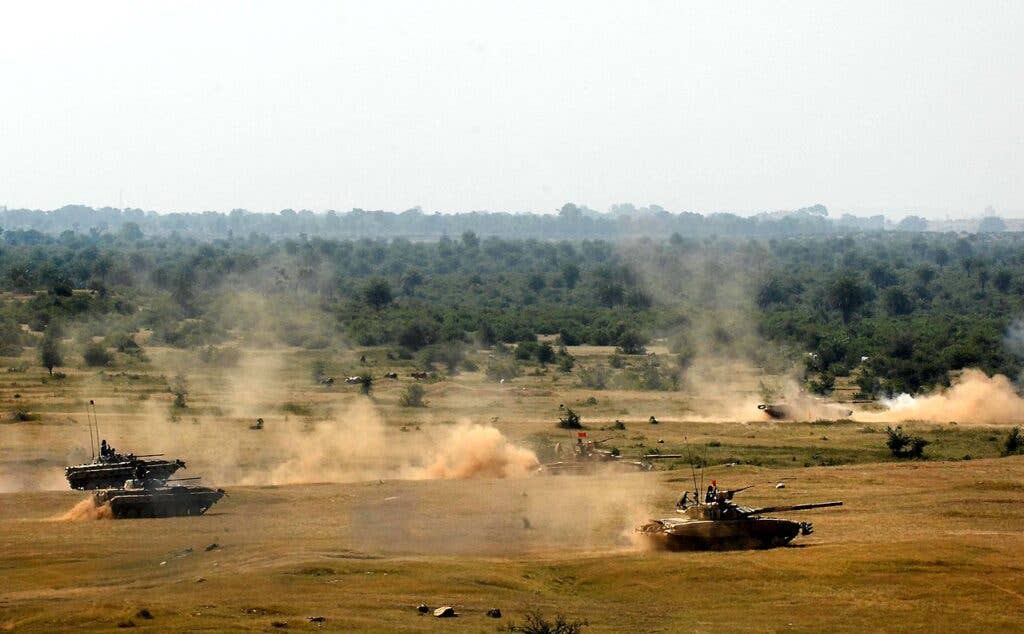 A mix of Indian army tanks and infantry vehicles onto the firing range. (Wikimedia Commons)
