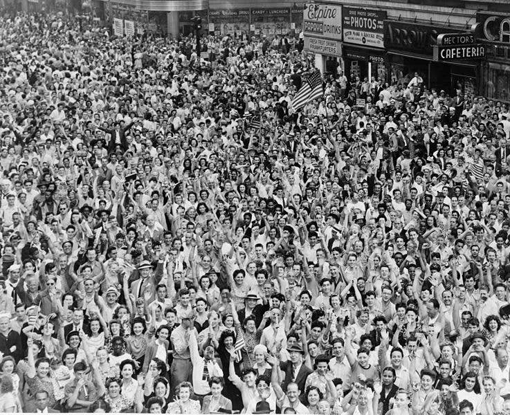<br>Crowd of people, many waving, in Times Square on V-J Day at time of announcement of the Japanese surrender in 1945 / World-Telegram photo by Dick DeMarsico. (Wikimedia Commons)<br>