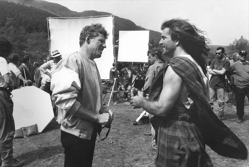 Scott Neeson on the set of Braveheart, 1995 with Mel Gibson (right). (Wikimedia Commons)
