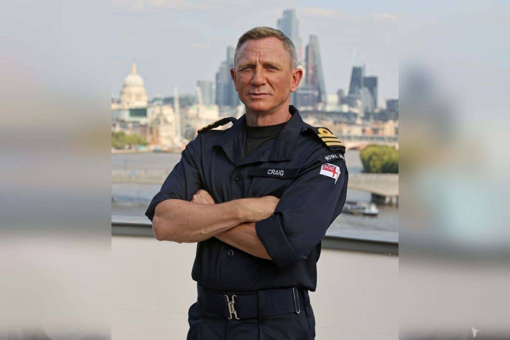 <em>Daniel Craig wears the Royal Navy working uniform with his new Commander ranks (Royal Navy)</em>