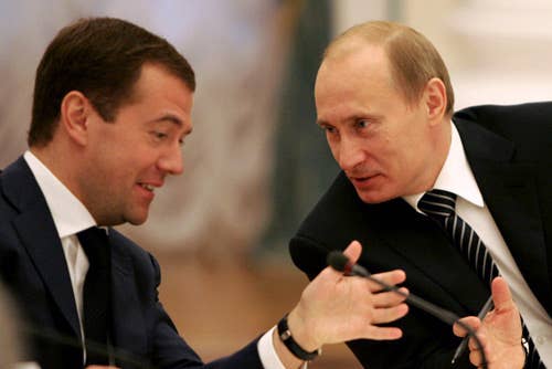 You try finding photos of Russians laughing. Putin with Dmitry Medvedev at the Meeting with State Duma Leadership and Faction leaders. (Wikimedia Commons)