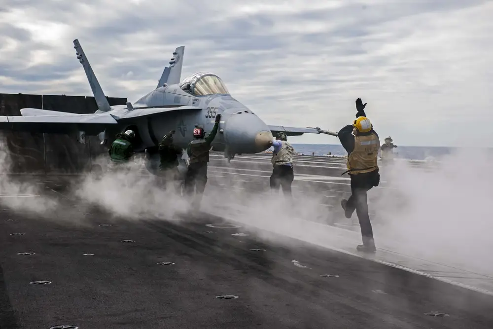 An F/A-18 Hornet assigned to the Gladiators of Strike Fighter Attack Squadron (VFA) 106 prepares to launch from the flight deck of the aircraft carrier <a href="https://www.wearethemighty.com/mighty-history/navy-birthday/" target="_blank" rel="noreferrer noopener">USS Theodore Roosevelt</a> (CVN 71). Theodore Roosevelt is underway preparing for future deployments. (U.S. Navy photo by Mass Communication Specialist Seaman Apprentice Alex Millar/Released)