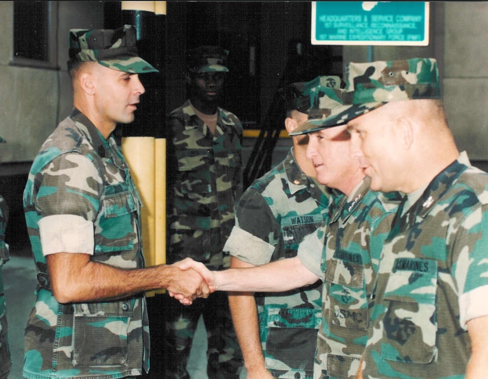 1stSgt Dever (left) 1st Force Recon Company shaking hands with Gen. Krulak (right) Commandant of the Marine Corps. Photo courtesy of Jim Dever.