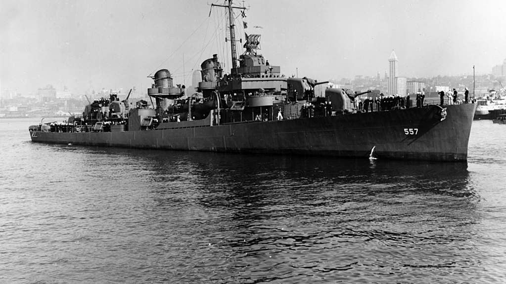 The U.S. Navy destroyer USS Johnston (DD-557) off Seattle, Washington (USA), on 27 October 1943. Smith Tower is in the background over the bow of the ship. (U.S. Navy photo)