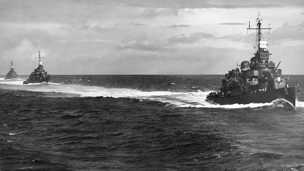 Three of the U.S. Navy Destroyer Squadron 21's ships underway steaming in column, while en route to Guadalcanal and Tulagi on 15 August 1943, following the Vella Lavella landings. The ships are (from front to rear): USS O'Bannon (DD-450), USS Chevalier (DD-451) and USS Taylor (DD-468). Photographed from USS Nicholas (DD-449). (U.S. Navy photo)