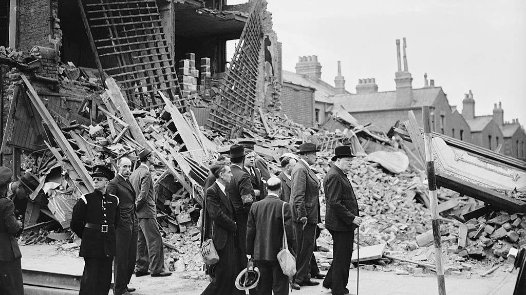 Prime Minister Winston Churchill visits bombed out buildings in the East End of London on 8 September 1940. (War Office official photographer, Puttnam)