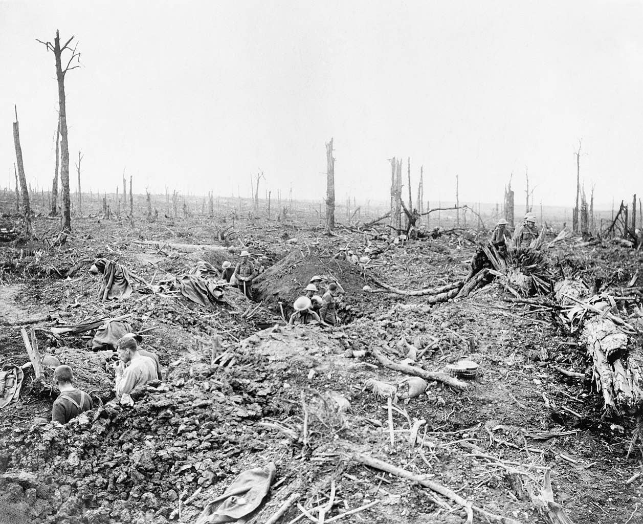The Battle of the Somme, July-november 1916
Battle of Bazentin Ridge, 14-17 July 1916. Soldiers digging a communication trench through Delville Wood. An officer observing from the ruins of Longueval Church. (Imperial War Museum)