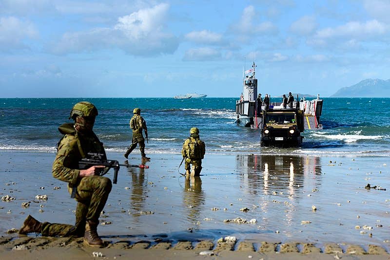 The Australian Defence Force provide security for a G-Wagon to come to shore via a LCM-1E Landing Craft as part of Exercise Horizon in Bowen, Queensland, May 28, 2018. The Series consists of command exercises, infantry sea routines and culminates with an amphibious assault. (Wikipedia)