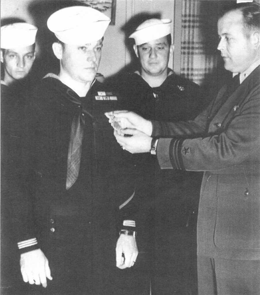 <em>Holder receives one of his many medals (Jack Holder)</em>