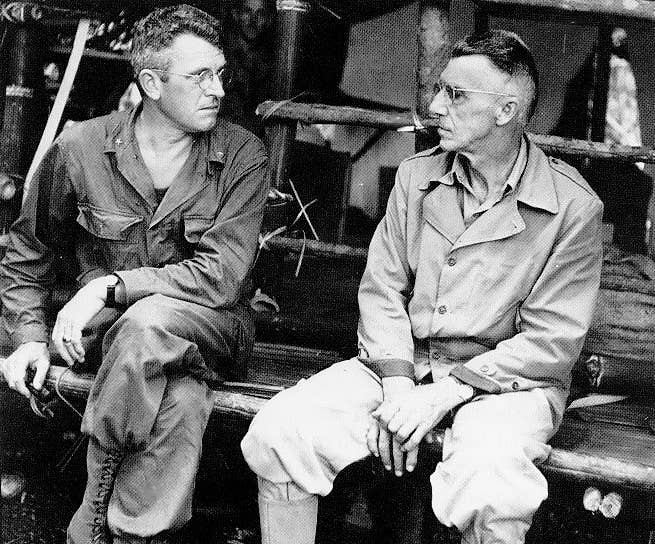 Brigade General Frank D. Merrill (left) and Lieutenant General Joseph W. Stilwell (right) meet near Naubum, Burma (Department of Defense)