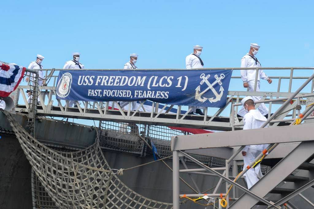 <em>Sailors disembark USS </em>Freedom<em> (LCS-1) during her decommissioning ceremony (U.S. Navy)</em>