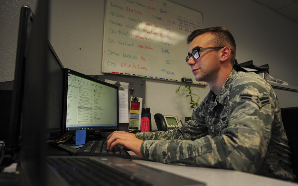 U.S. Air Force Airman 1st Class Braeden Pruett, 355th Communications Squadron cyber security technician, updates slides. (U.S. Air Force photo by Airman Frankie D. Moore)