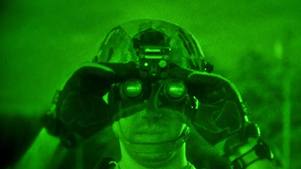 U.S. Air Force 1st Lt. Andrew Bruno adjusts his night vision goggles on April 10, 2014 at Fort Dix, N.J. The New Jersey Army and Air National Guardsmen took part in a joint training exercise with the U.S. Marine Corps. Bruno is an air laison officer from the New Jersey Air National Guard's 227th Air Support Operations Squadron. (U.S. Air National Guard photo by Tech. Sgt. Matt Hecht/Released)