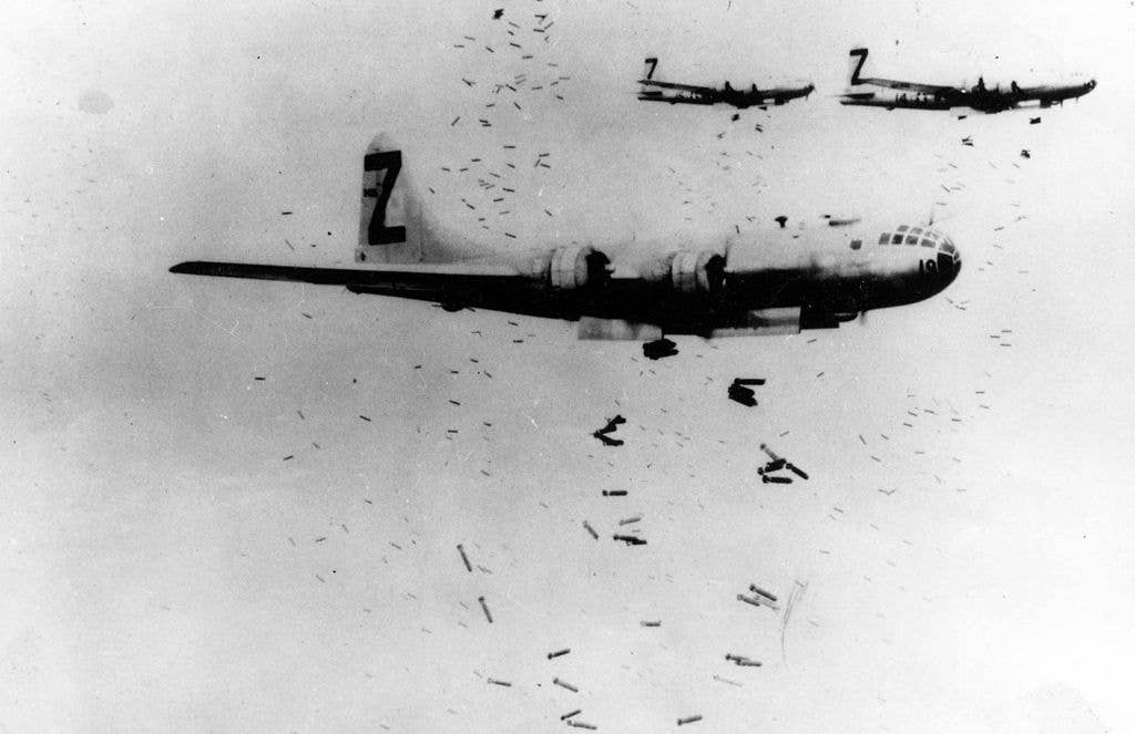 B-29 Superfortress bombers dropping incendiary bombs on Yokohama during May 1945. (U.S. Air Force)